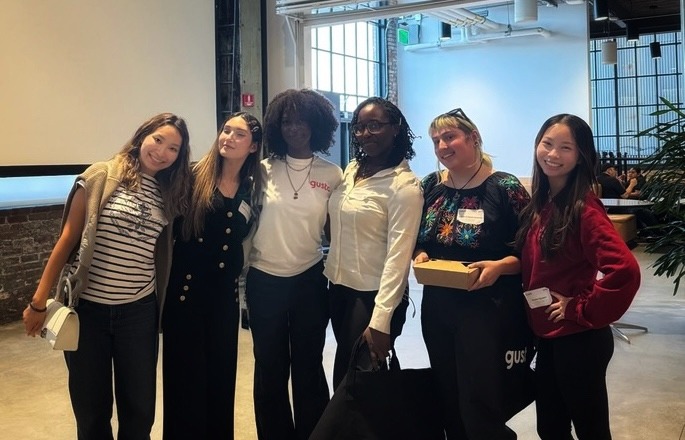Nicole with a group of friends indoors