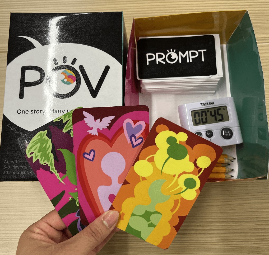 POV box open with prompt cards, a timer, and character cards